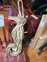 Full view of driftwood seahorse hanging on chair