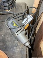 Full view of McCulloch corded impact wrench on workbench