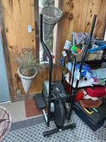 Full view of Orbitrek elliptical showing frame, handlebars and pedals