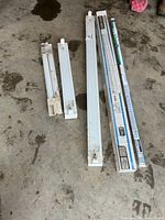 Full view of both fixtures and packaged tubes on floor