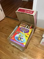 Box filled with assorted children’s books