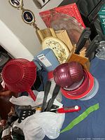 Group shot showing colander, bowls, onion keeper halves, utensils, electric kettle, knife block, serving tray