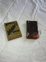 Front view of both books side by side on bed