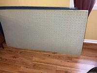 Memory foam pad front view leaning against wall