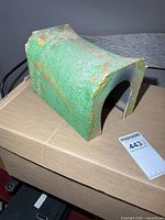 Angled view of the green model railroad tunnel showing textured surface