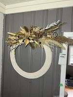 Full view of rope wreath on wall