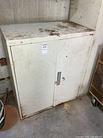 Front view closed cabinet showing two doors and handle