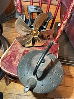 Stove fan and kettle together on chair