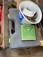 Closed blue Mastercraft case with Vermont screw extractor box and plastic tub of bolts on top