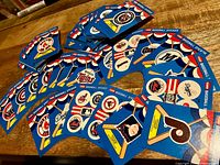 Stacked 1989 Fleer baseball logo sticker cards spread out on table