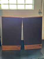 Both Advent Legacy II speakers with grills on