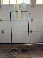 Full view of both floor lamps standing side by side