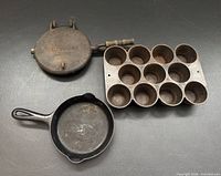 Overall view of all three cast-iron pieces