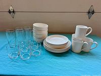 full grouping of all dinnerware and glasses