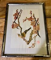 Full view of framed papyrus artwork