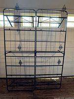Front view of entire folding metal bed frame upright