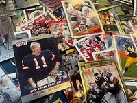 Scattered cards highlighting Phil Simms Pro Set, Chris Hinton card and others