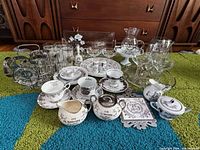 Full lot showing porcelain and glass pieces grouped together