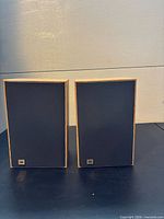 Front view of both JBL J2045 speakers with grilles on