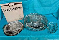 Overview of both Kromex serving sets with box