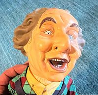 Front close-up of Larry puppet head and upper torso