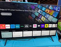 Television front view powered on showing smart interface