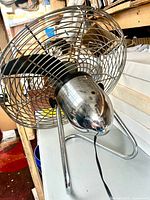 Overall view of Dayton chrome fan on tubular stand