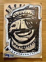 Front of comic page with graffiti artwork and signature