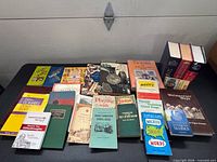 Full lot showing all reference books spread on table