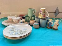 Group shot showing all dinnerware, mugs, décor items