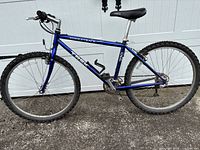 Full left-side view of blue Trek Singletrack 930 bike