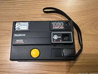 Front view of Keystone 1030 Everflash camera, flash, shutter button, branding visible