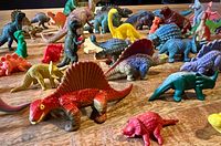 group view of mixed plastic dinosaur figurines on table