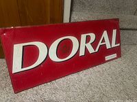 Full view of DORAL metal tin sign front