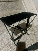 stool set up showing canvas seat and X-frame