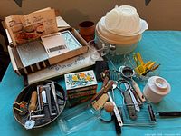 Overall view of entire mixed kitchen lot on table