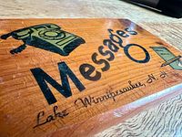 Front view showing full graphic and text on plaque