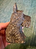 Side profile of cast iron Scottish terrier bank
