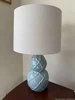 Full view of lamp showing base and shade