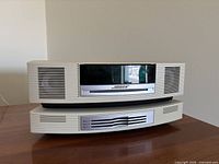 Front view of Bose Wave Music System stacked on Multi-CD Changer