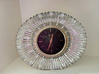 Front view of oval faceted crystal mantle clock