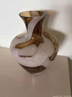 Front view of brown and sandy swirl glass vase