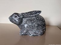 Left side view of grey veined marble rabbit figurine
