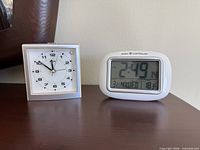 Front view of both clocks on tabletop