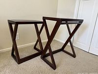 front three-quarter view of both nesting tables showing Z-shaped frames
