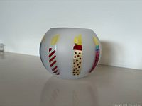 Front view showing candle designs