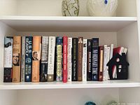 Shelf showing entire grouping of books and bookend