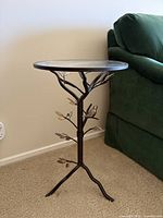 Full view of the glass-top tripod end table