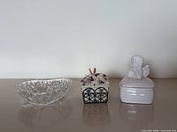 Three decorative items side by side on surface