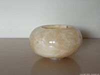 front view of polished onyx tealight holder showing rounded body